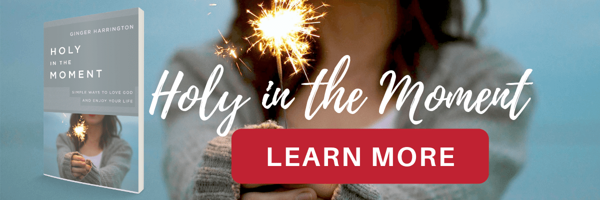 Woman holding sparkler, book cover for Holy in the Moment, red "Learn More" button.