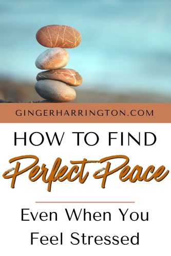 Stacking stones against blue water are background to illustrate post on how to find perfect peace from Isaiah 26:3.